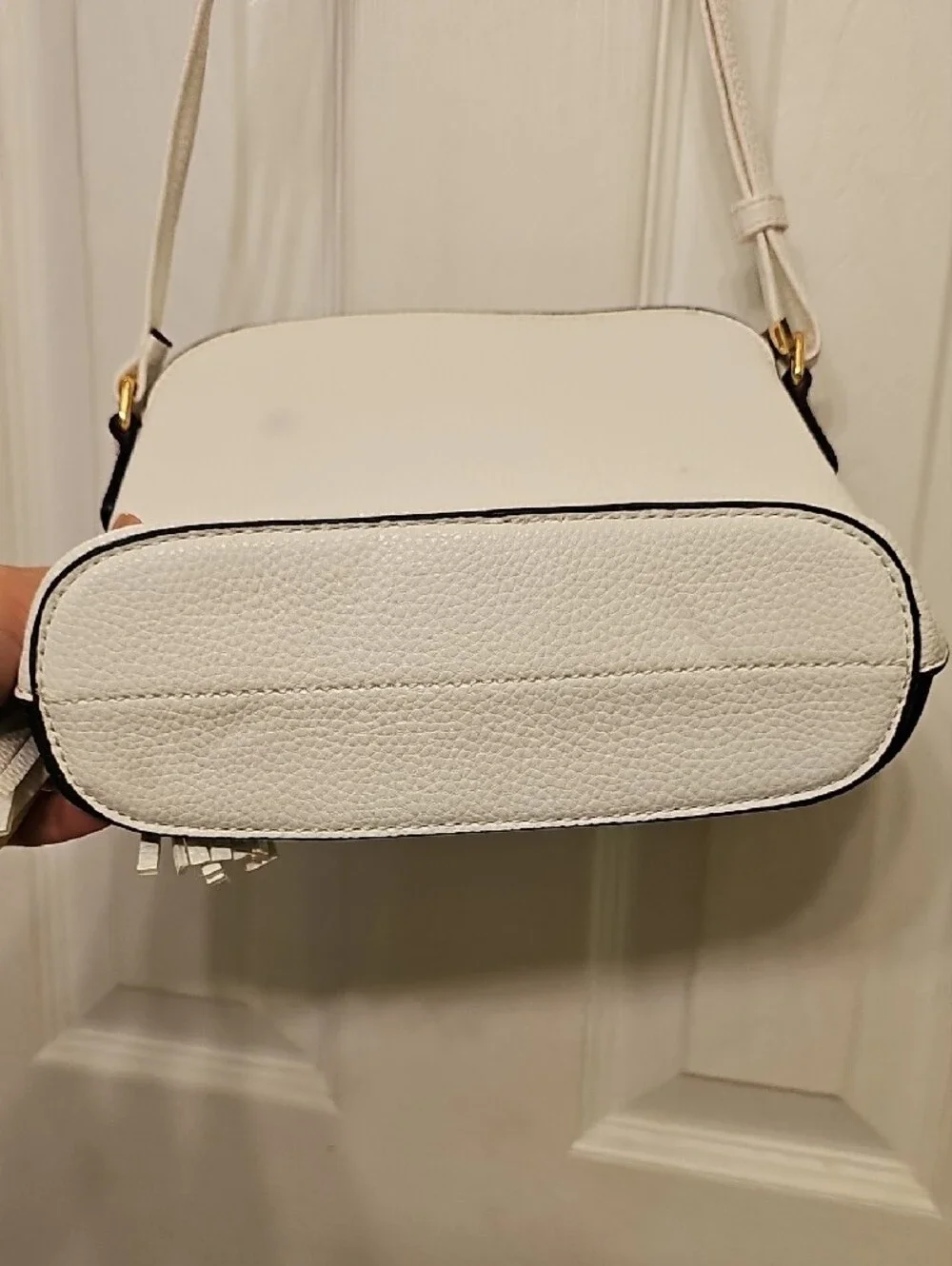 Two-Tone White and Black Crossbody Bag with Tassel Accent